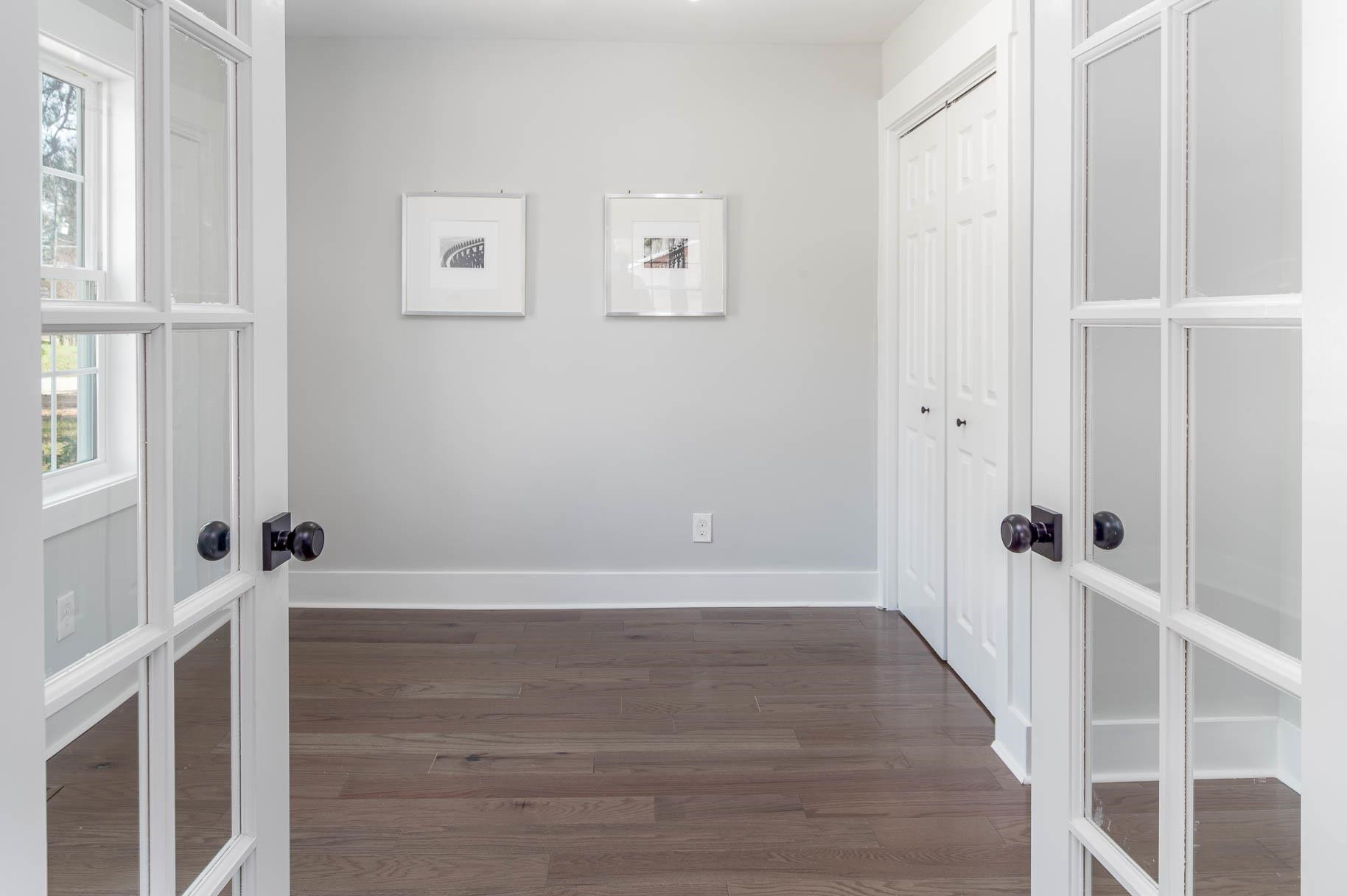2108 Ramseur Street Raleigh, NC 27610 - Photo 7 of 26 a view of an empty room with wooden floor
