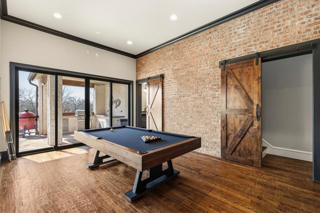 8301 Stephens Ranch Road Pilot Point, TX 76258 - Photo 14 of 40 This rooms is great with exposed brick wall