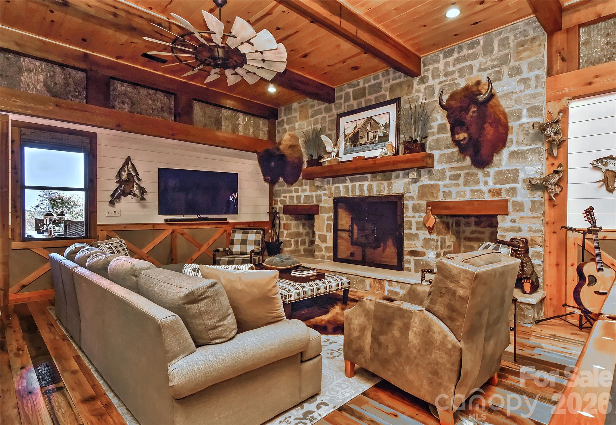 153 Badenyon Place Union Grove, NC 28689 - Photo 12 of 48 a living room with furniture a fireplace and a flat screen tv