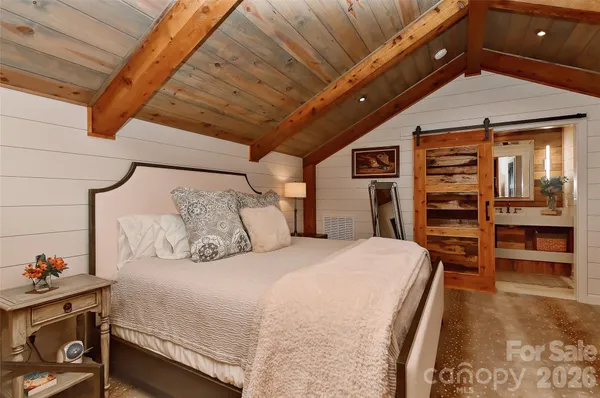 a bedroom with a bed and dresser
