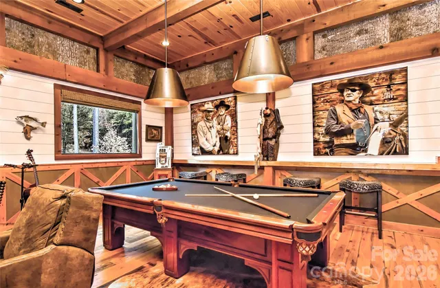 a dining room with a table and chairs