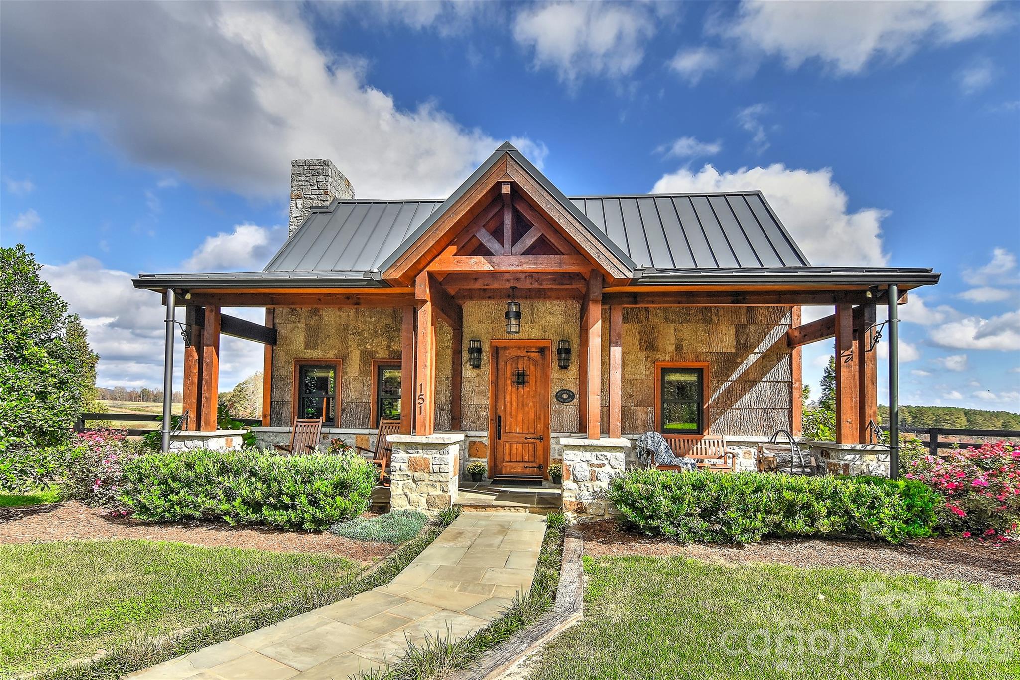 153 Badenyon Place Union Grove, NC 28689 - Photo 19 of 48 a front view of a house with garden