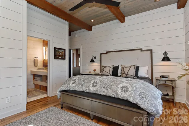 a bedroom with a bed and dresser