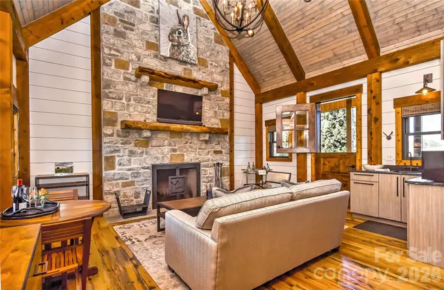 a living room with furniture fireplace and flat screen tv