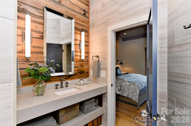 a bathroom with a sink and a mirror