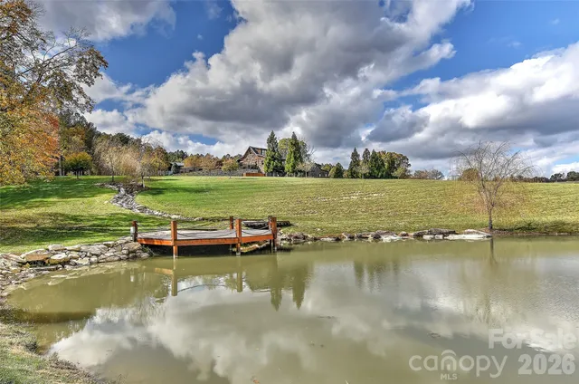 a view of an ocean with beach and outdoor seating