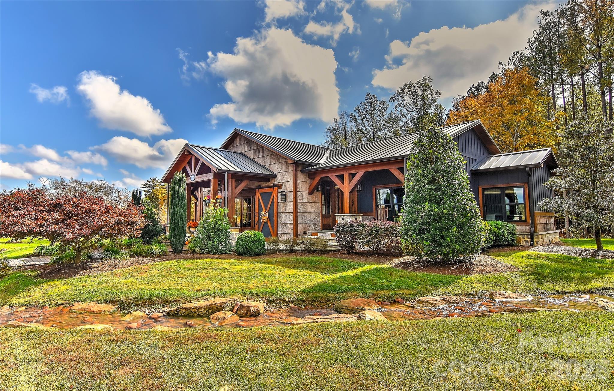 153 Badenyon Place Union Grove, NC 28689 - Photo 7 of 48 a view of a house with a big yard and large trees