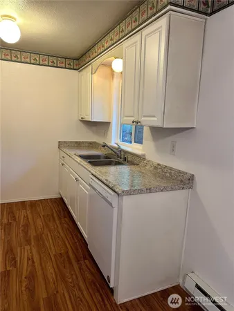 a kitchen with a refrigerator and a stove