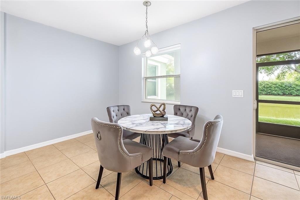 19550 Bowring Park Road, Unit 102 Fort Myers, FL 33967 - Photo 3 of 20 a view of a dining room with furniture and a window