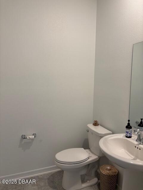 3966 Willowbrook Drive Edgewater, FL 32141 - Photo 11 of 20 a white toilet sitting next to a bathroom sink