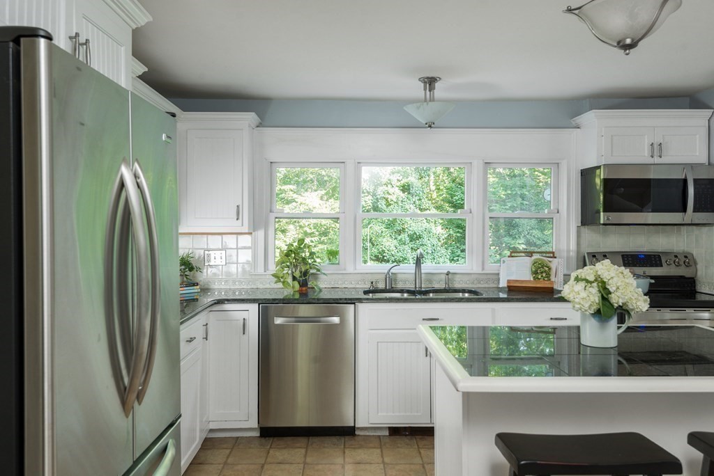 7 Longfellow Road Winchester, MA 01890 - Photo 16 of 42 a kitchen with stainless steel appliances granite countertop a refrigerator and a sink