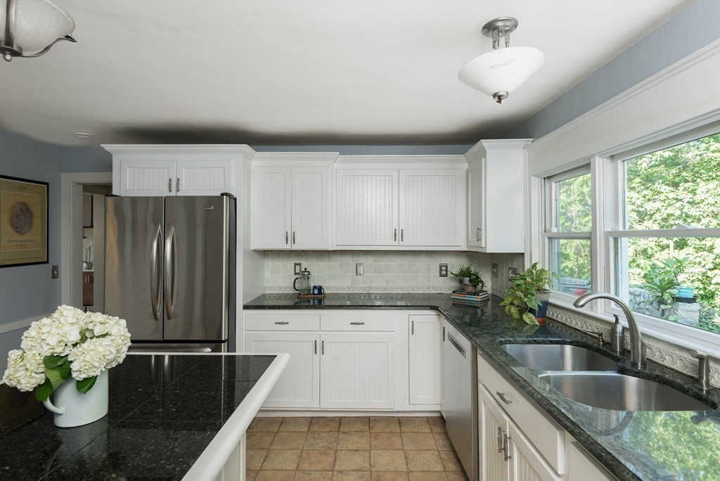 7 Longfellow Road Winchester, MA 01890 - Photo 17 of 42 a kitchen that has a sink cabinets counter space and appliances