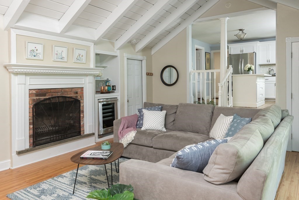 7 Longfellow Road Winchester, MA 01890 - Photo 19 of 42 a living room with furniture and a fireplace