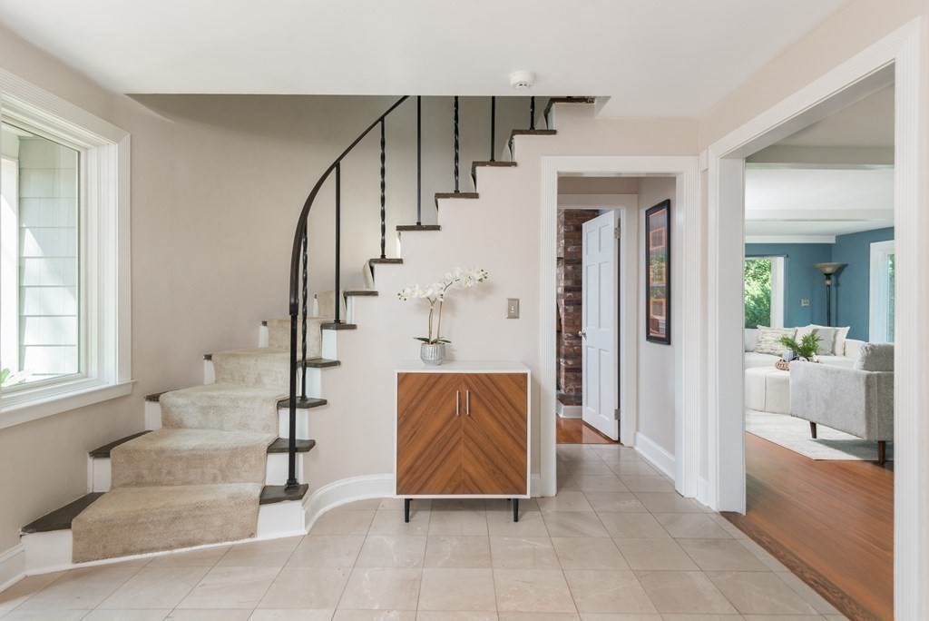 7 Longfellow Road Winchester, MA 01890 - Photo 23 of 42 a view of an entryway with wooden floor and a livingroom