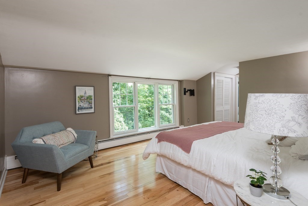 7 Longfellow Road Winchester, MA 01890 - Photo 25 of 42 a bedroom with a bed and a chair