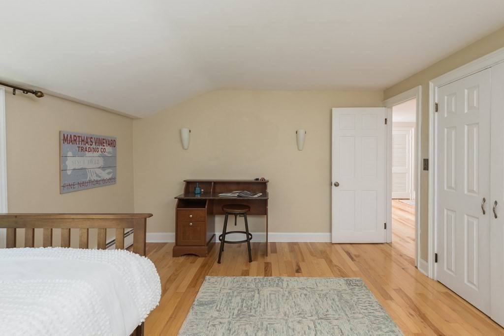 7 Longfellow Road Winchester, MA 01890 - Photo 31 of 42 a bedroom with a bed and a table in it