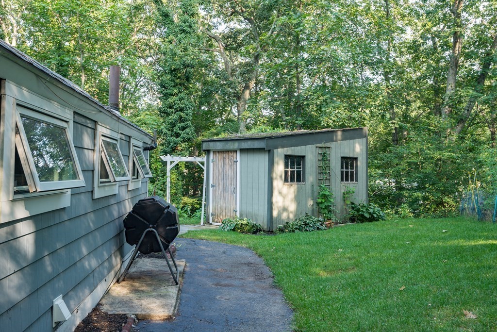 7 Longfellow Road Winchester, MA 01890 - Photo 34 of 42 a house view with a seating space and garden