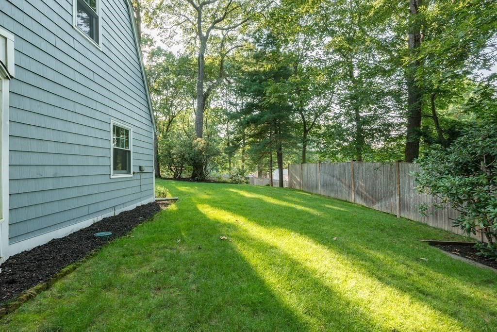 7 Longfellow Road Winchester, MA 01890 - Photo 38 of 42 a view of a backyard with a small cabin