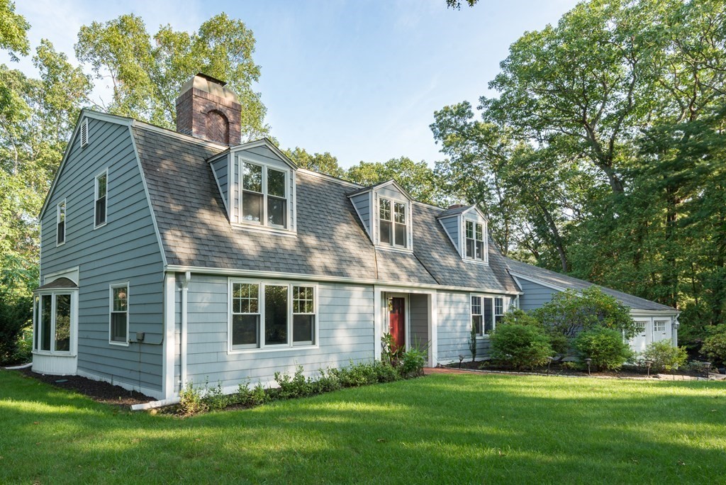 7 Longfellow Road Winchester, MA 01890 - Photo 39 of 42 a front view of a house with a garden