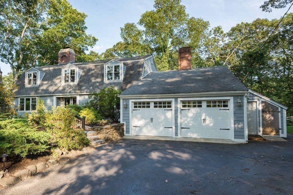 7 Longfellow Road Winchester, MA 01890 - Photo 40 of 42 a front view of a house with a garden