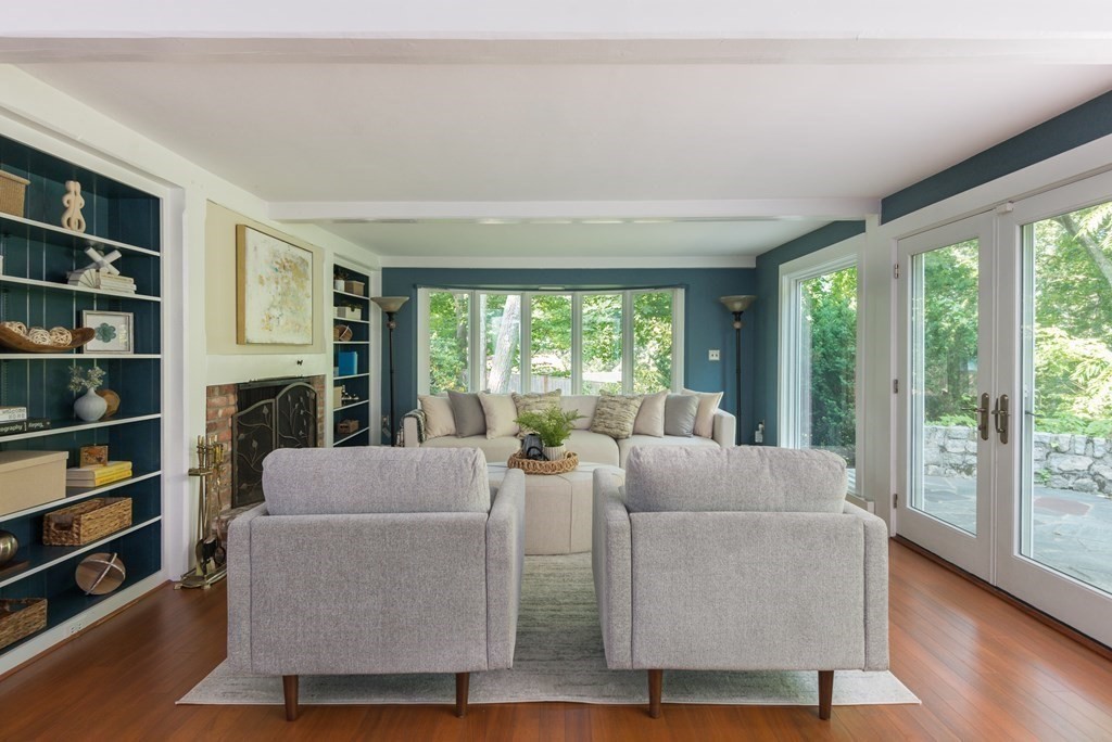 7 Longfellow Road Winchester, MA 01890 - Photo 4 of 42 a living room with fireplace furniture and a large window
