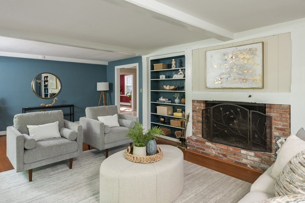 7 Longfellow Road Winchester, MA 01890 - Photo 6 of 42 a living room with furniture and a fireplace