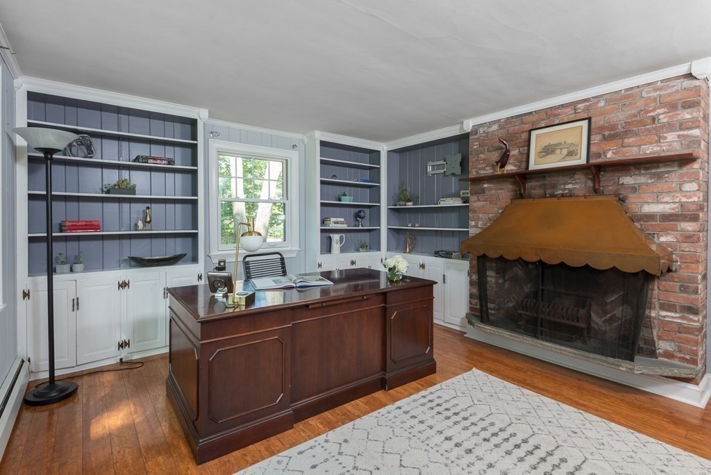 7 Longfellow Road Winchester, MA 01890 - Photo 10 of 42 a room with furniture and a fireplace
