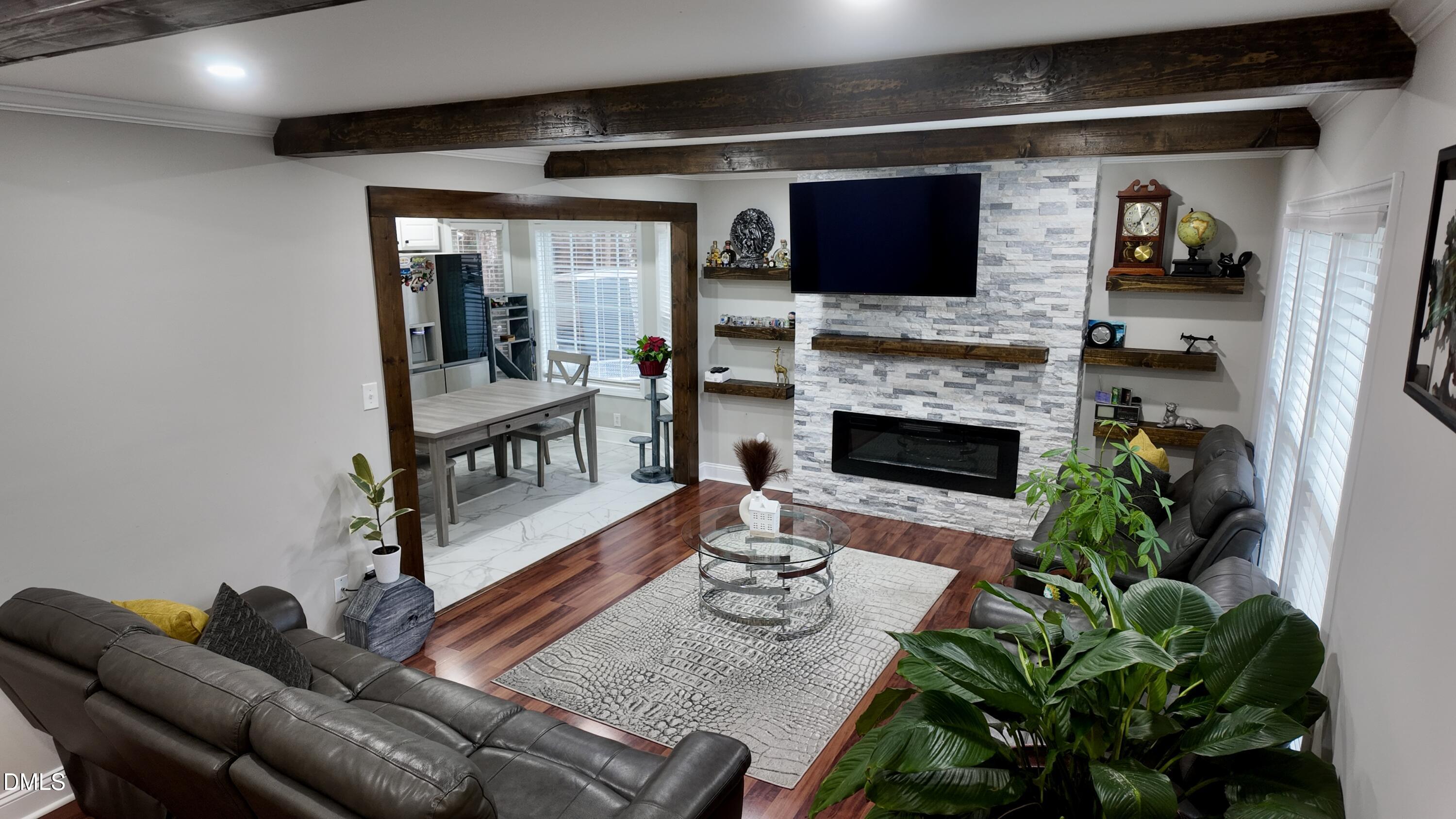 1020 Laurel Leaf Road Zebulon, NC 27597 - Photo 11 of 27 a living room with furniture and a fireplace