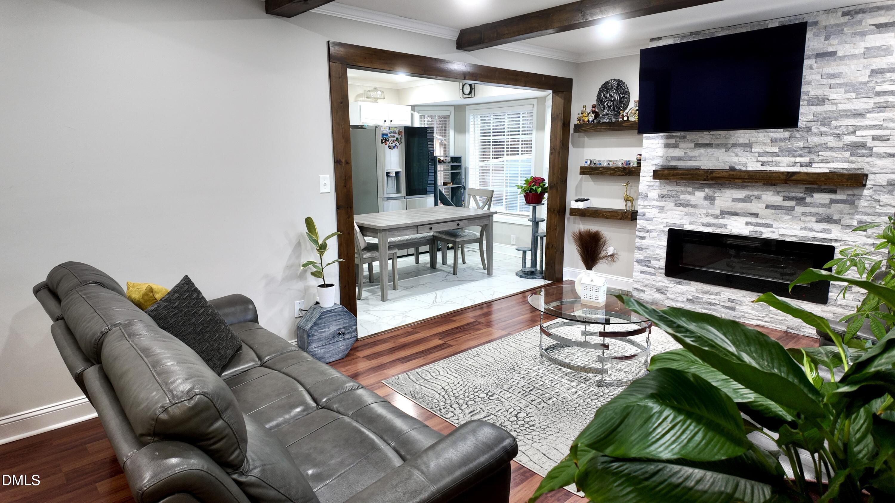 1020 Laurel Leaf Road Zebulon, NC 27597 - Photo 12 of 27 a living room with furniture fireplace and flat screen tv