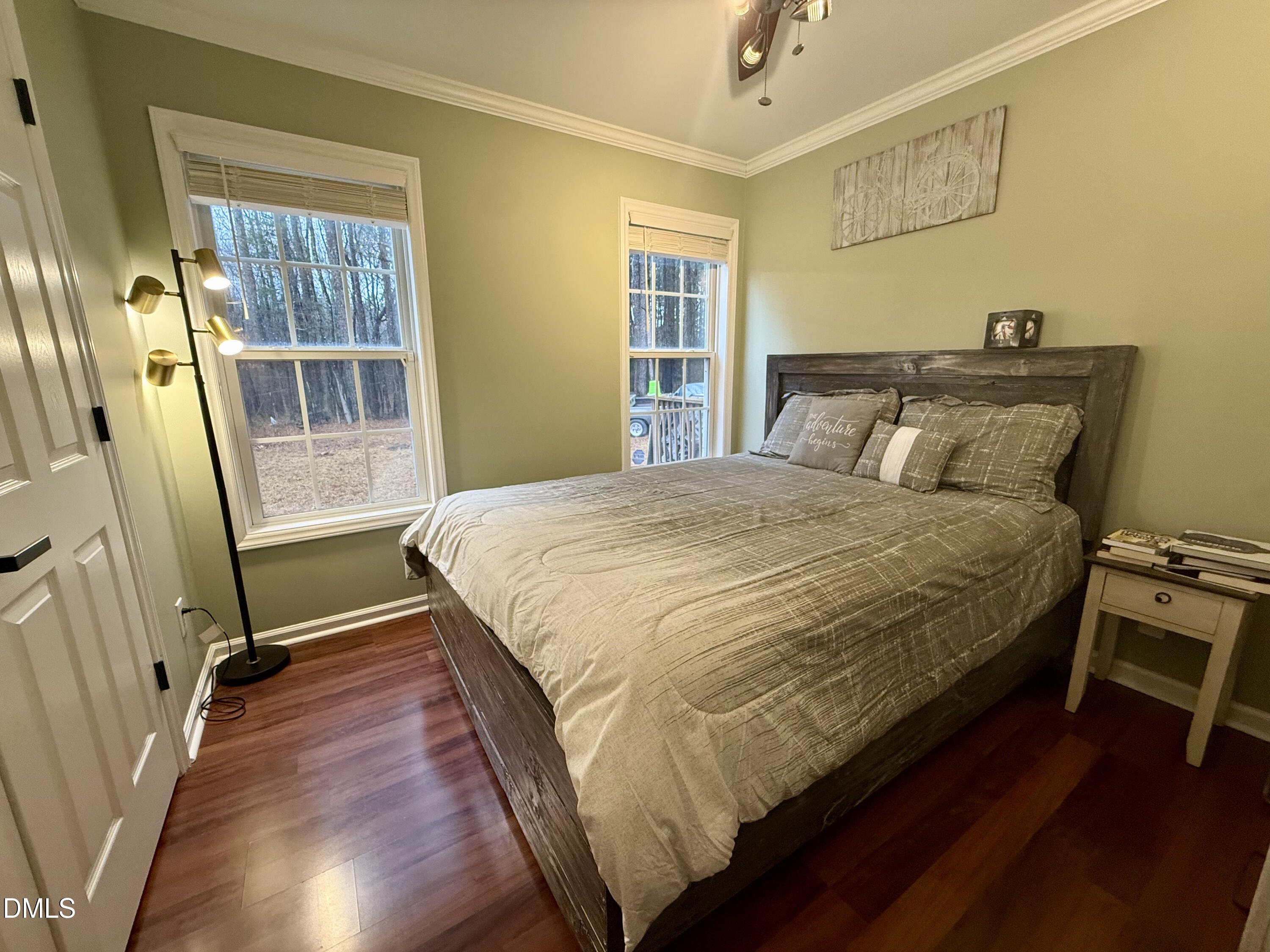 1020 Laurel Leaf Road Zebulon, NC 27597 - Photo 23 of 27 a bed sitting in a bedroom next to a window