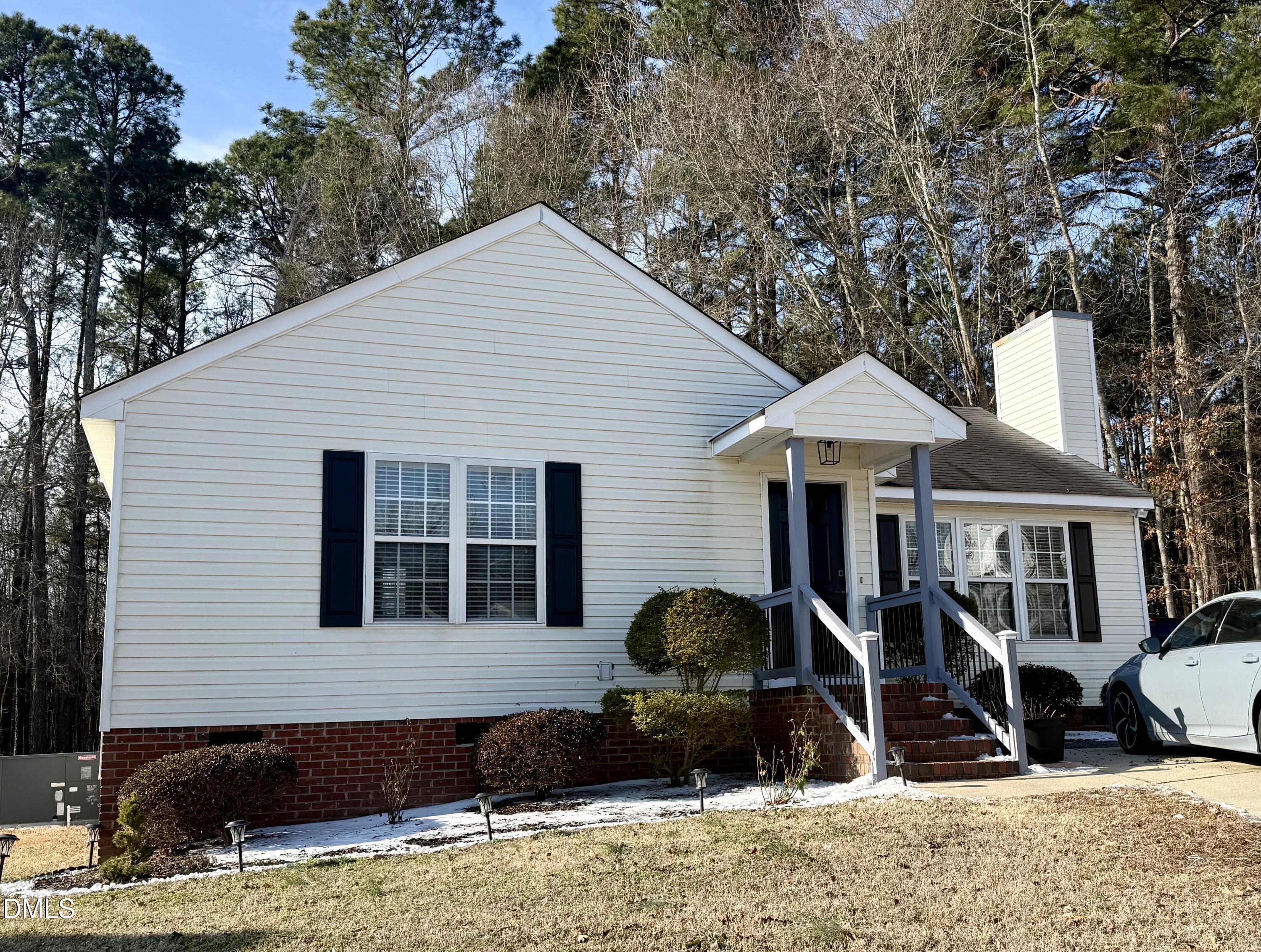 1020 Laurel Leaf Road Zebulon, NC 27597 - Photo 3 of 27 a front view of a house with a yard