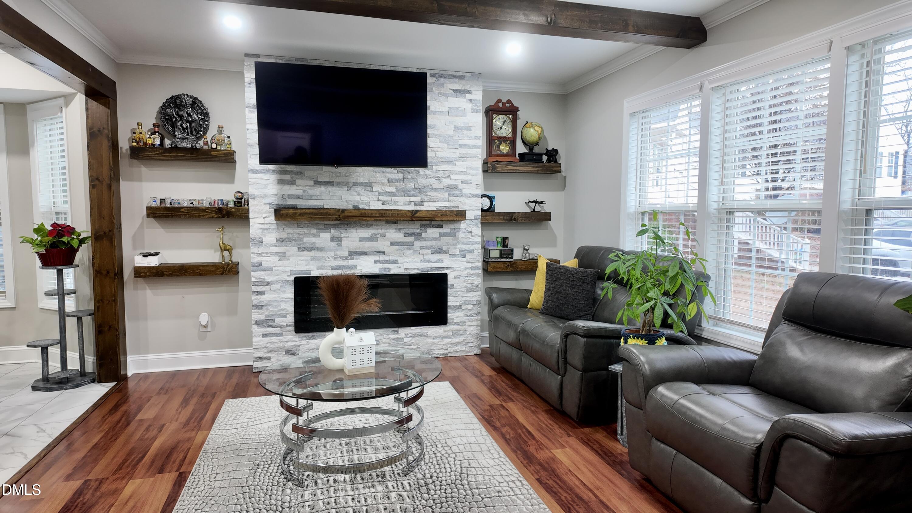 1020 Laurel Leaf Road Zebulon, NC 27597 - Photo 8 of 27 a living room with furniture and a fireplace