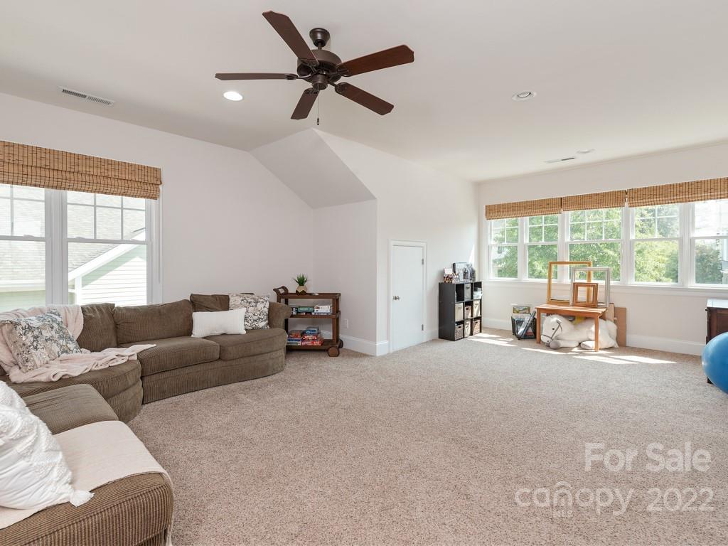 5711 Morris Hunt Drive Fort Mill, SC 29708 - Photo 19 of 43 a living room with furniture and a large window