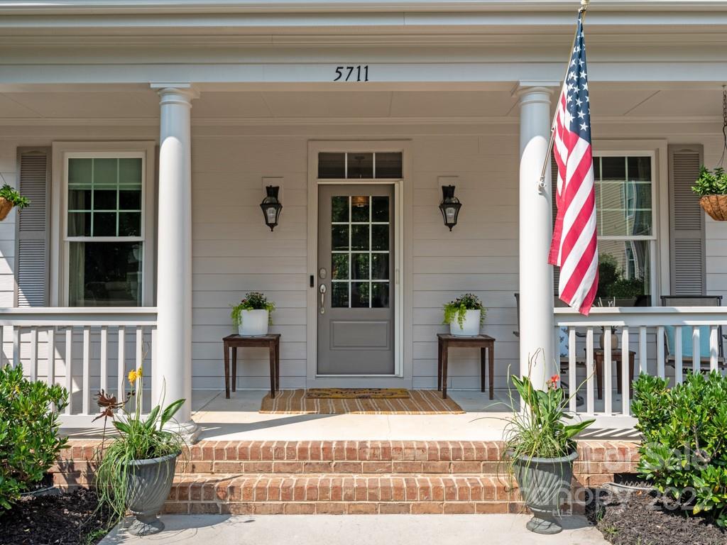 5711 Morris Hunt Drive Fort Mill, SC 29708 - Photo 2 of 43 a front view of a house with a garden