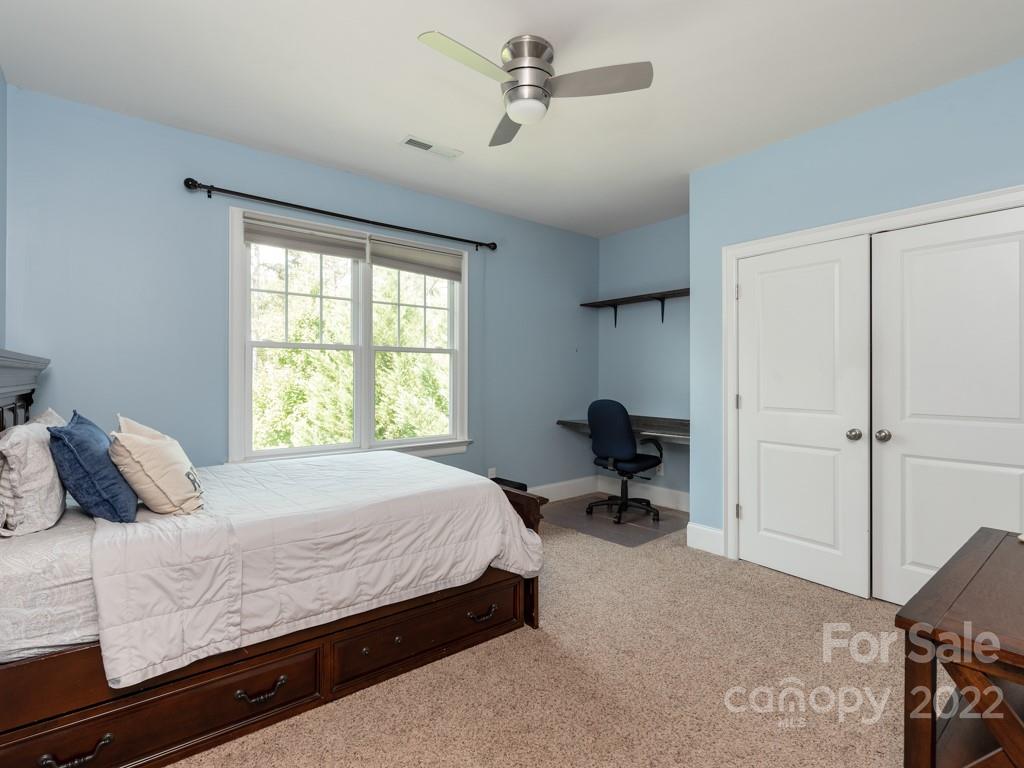 5711 Morris Hunt Drive Fort Mill, SC 29708 - Photo 21 of 43 a bedroom with a bed and a window