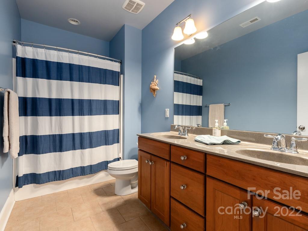 5711 Morris Hunt Drive Fort Mill, SC 29708 - Photo 22 of 43 a bathroom with a sink toilet and shower