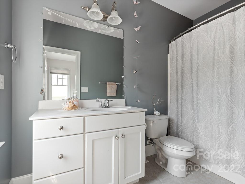5711 Morris Hunt Drive Fort Mill, SC 29708 - Photo 24 of 43 a bathroom with a toilet a sink and mirror