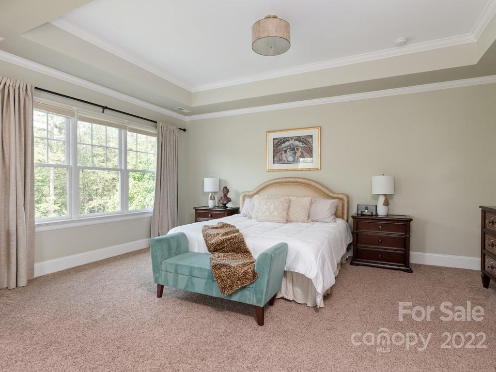 5711 Morris Hunt Drive Fort Mill, SC 29708 - Photo 26 of 43 a spacious bedroom with a bed and a window