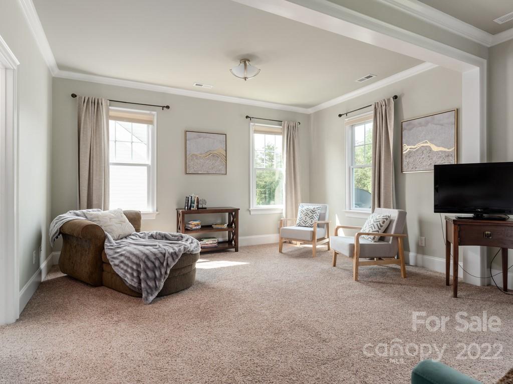 5711 Morris Hunt Drive Fort Mill, SC 29708 - Photo 27 of 43 a living room with furniture and a flat screen tv