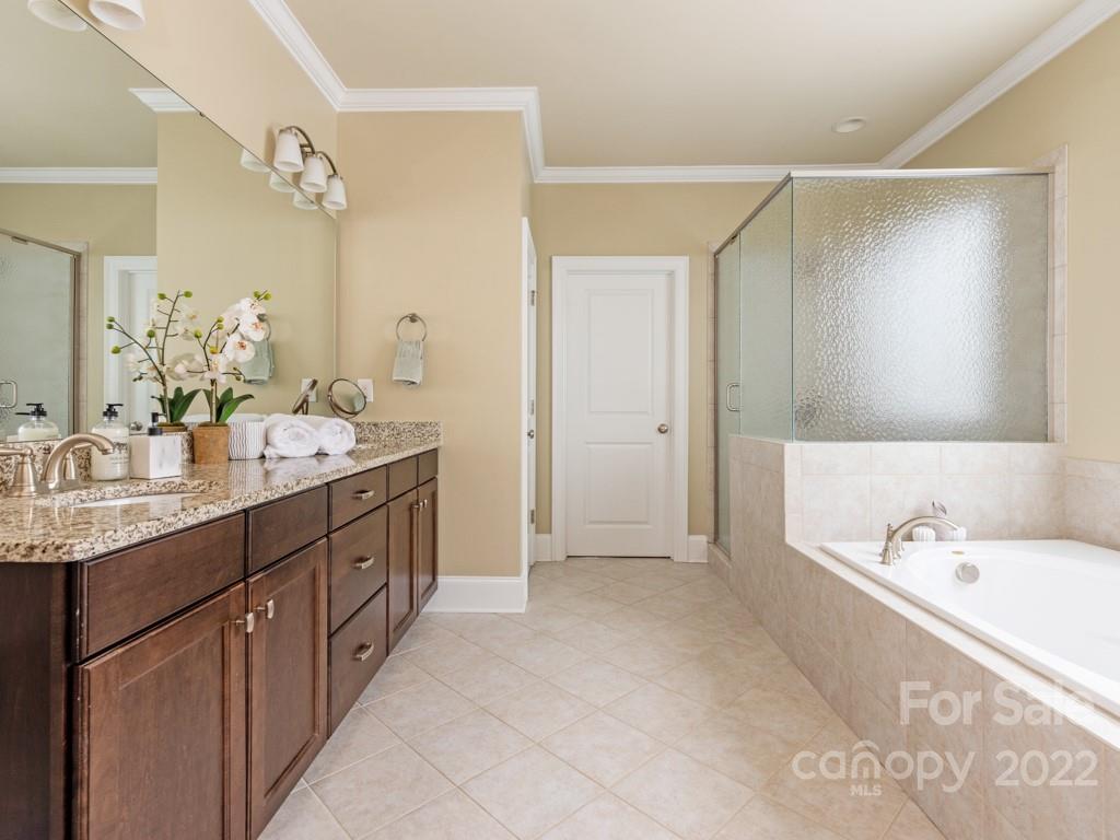 5711 Morris Hunt Drive Fort Mill, SC 29708 - Photo 28 of 43 a spacious bathroom with a double vanity sink mirror double and bathtub
