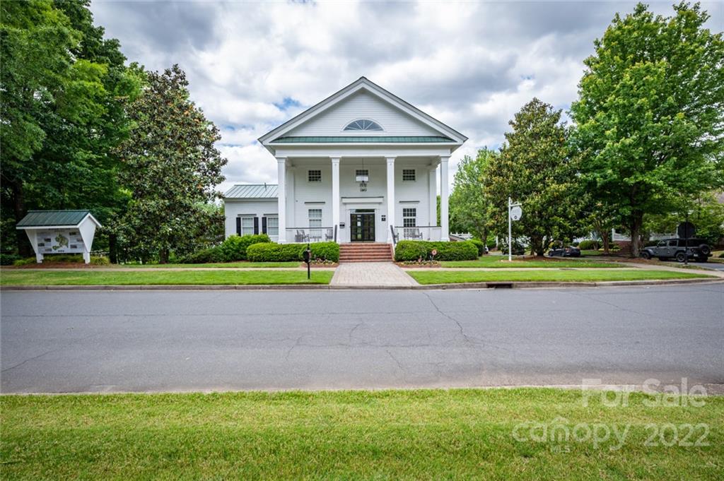 5711 Morris Hunt Drive Fort Mill, SC 29708 - Photo 39 of 43 a front view of a house with a yard and a large tree
