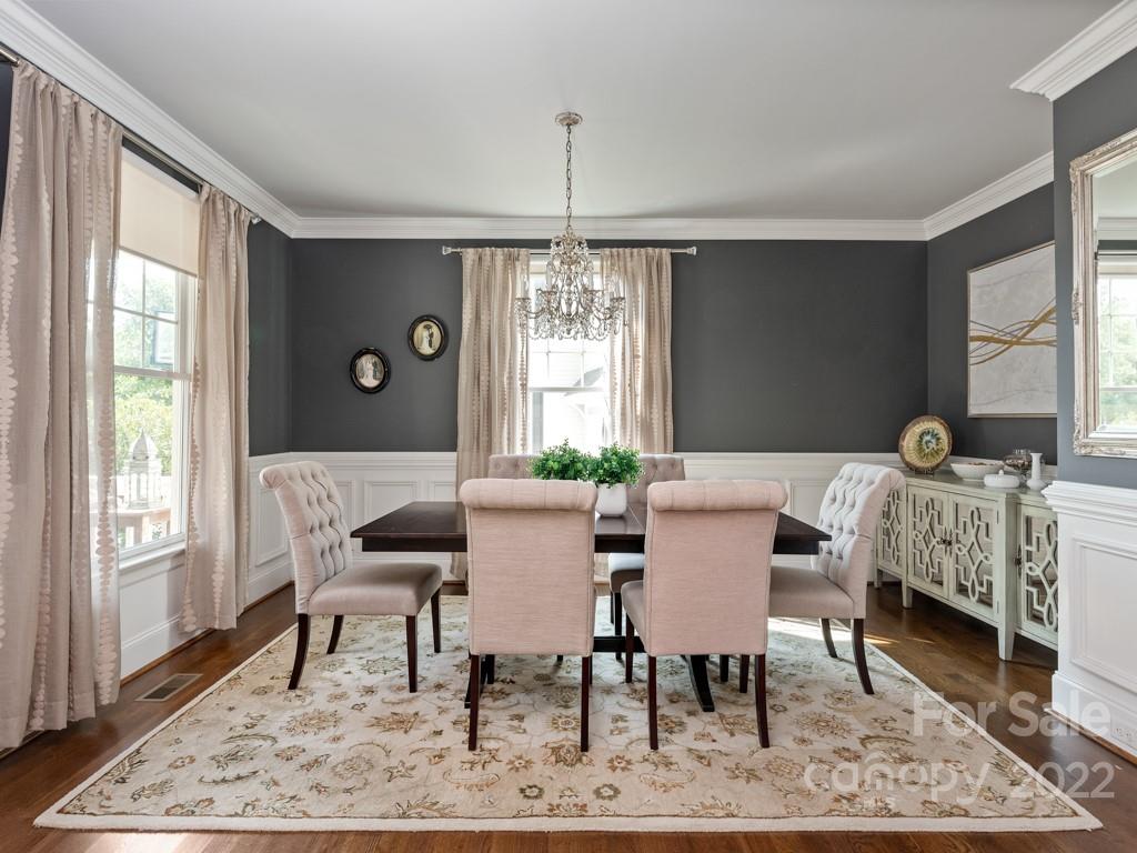 5711 Morris Hunt Drive Fort Mill, SC 29708 - Photo 5 of 43 a view of a dining room with furniture window and wooden floor