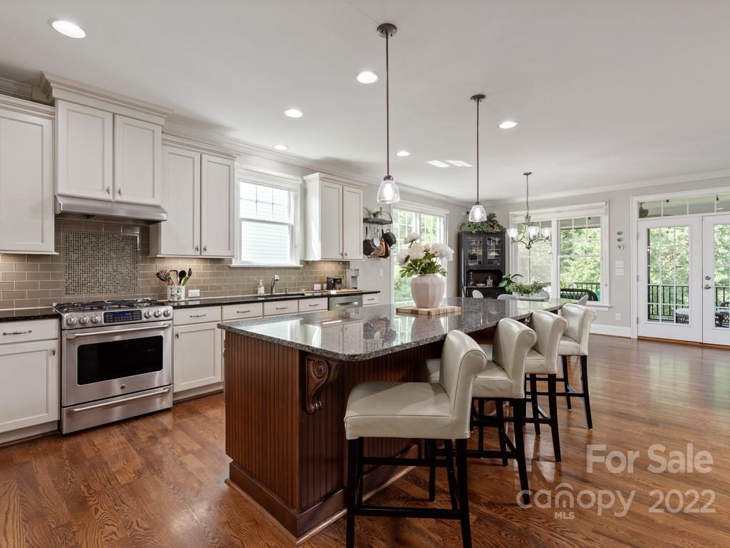 5711 Morris Hunt Drive Fort Mill, SC 29708 - Photo 8 of 43 a large kitchen with a table and chairs