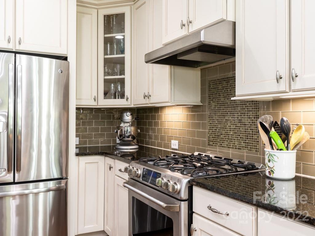 5711 Morris Hunt Drive Fort Mill, SC 29708 - Photo 10 of 43 a kitchen with a stove and white cabinets