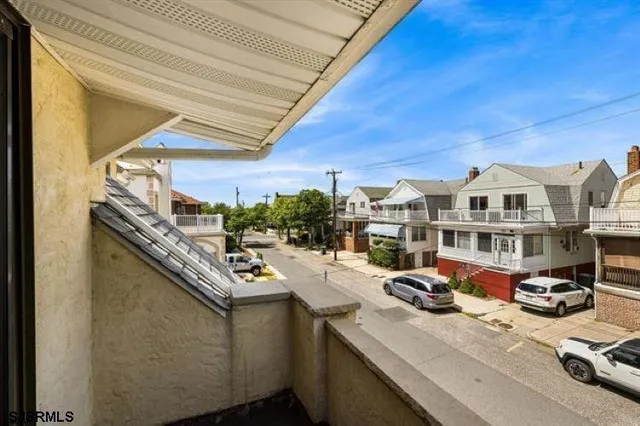 a view of a car park in front of a house