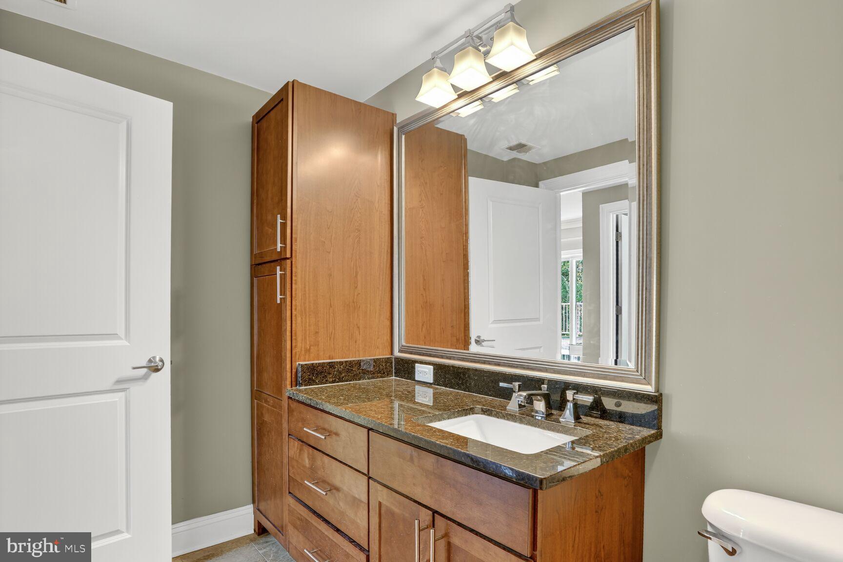 6301 Edsall Road, Unit 123 Alexandria, VA 22312 - Photo 13 of 36 Sleek modern bathroom with elegant finishes.