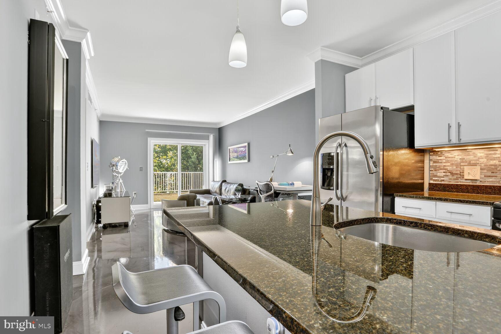 6301 Edsall Road, Unit 123 Alexandria, VA 22312 - Photo 3 of 36 Modern kitchen with sleek finishes and light.