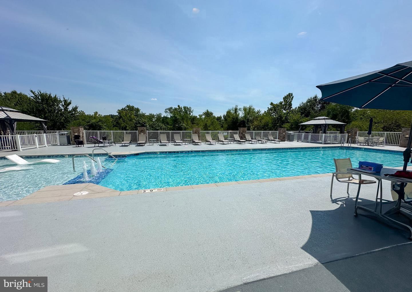6301 Edsall Road, Unit 123 Alexandria, VA 22312 - Photo 31 of 36 Serene poolside retreat in lush surroundings.