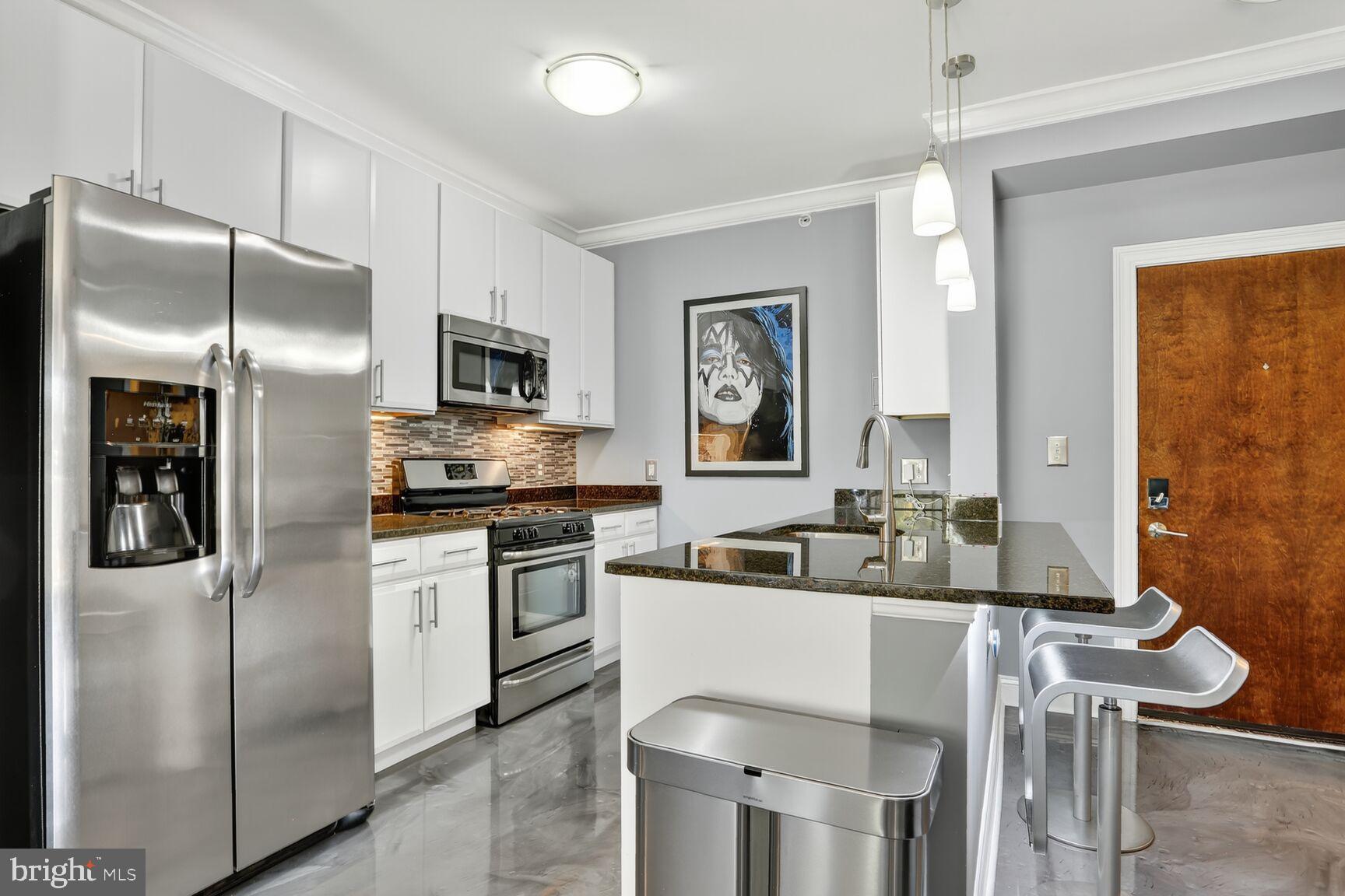 6301 Edsall Road, Unit 123 Alexandria, VA 22312 - Photo 5 of 36 Sleek modern kitchen with stylish finishes.