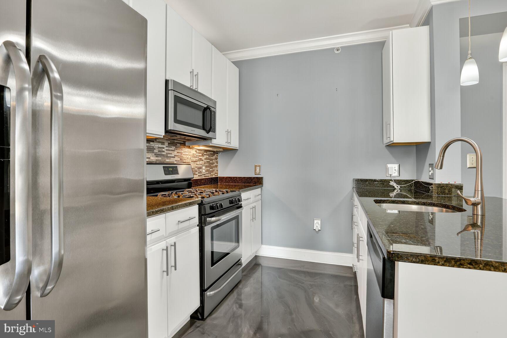 6301 Edsall Road, Unit 123 Alexandria, VA 22312 - Photo 6 of 36 Sleek modern kitchen with stylish finishes.